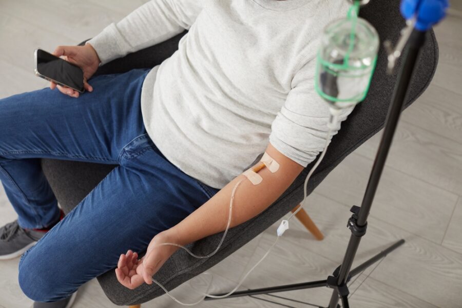 Patient receiving professional IV hydration therapy in a comfortable setting, delivering fluids and nutrients directly into the bloodstream for fast hydration, energy, and recovery support – IV hydration therapy